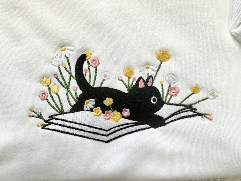 Cute Lying On The Book Cat Embroidered Sweatshirt